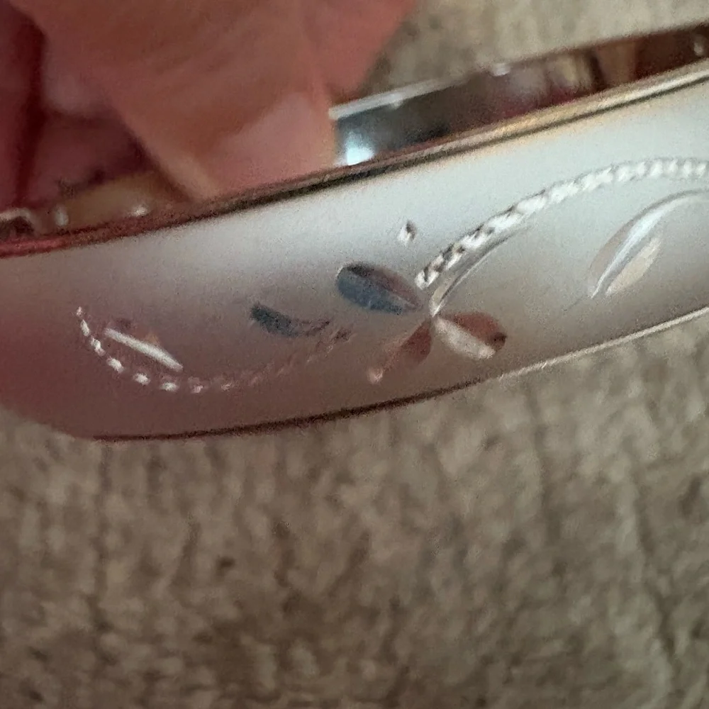 GUC silver tone bangle with safety chain